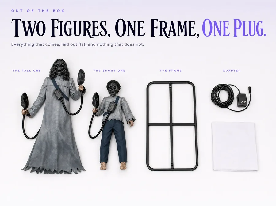 Flat-lay on white: the two figures, the shared metal frame, the power adapter and a folded instruction sheet.