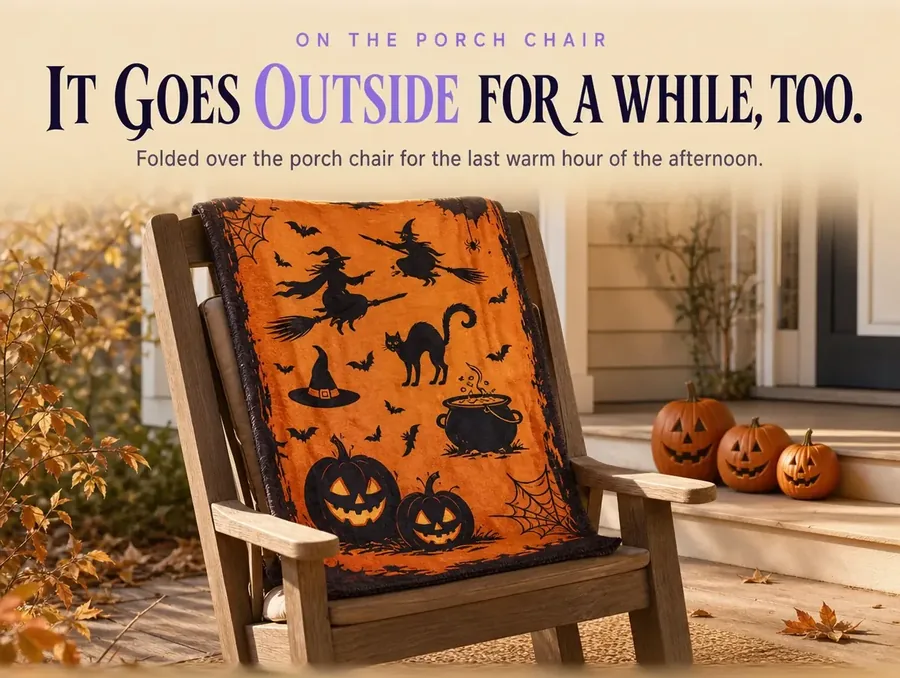 The throw folded over a porch chair in late-afternoon light, small carved pumpkins on the steps nearby.