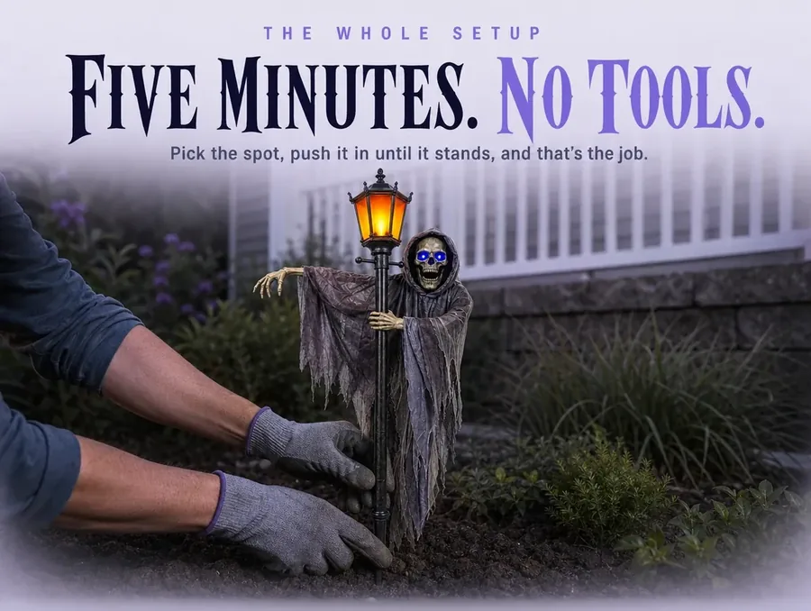 Gloved hands pushing the stake into soft soil beside a garden bed, no tools in sight