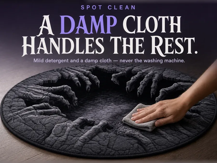 A hand spot-cleaning a corner of the illusion rug with a damp cloth.