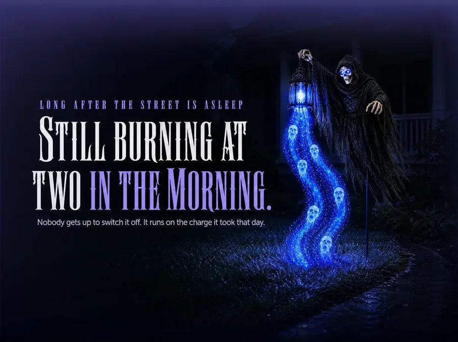 A sleeping dark yard where the lit cascade is the only light left burning
