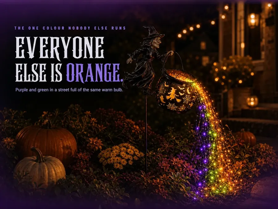 The cauldron's orange, green and purple cascade against neighbouring plain orange lights