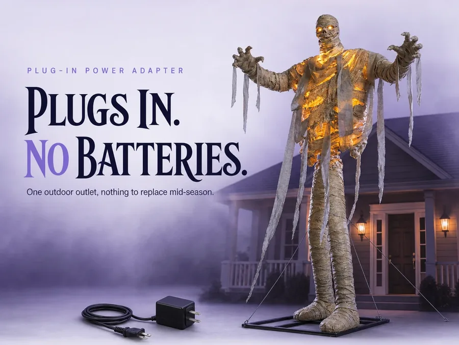 Studio macro of the mummy's plug-in power adapter and cord resting beside its wrapped foot.